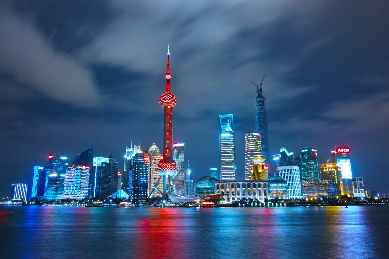 Traveler-relevant Shanghai Pudong skyline at night with the Oriental Pearl Tower, illustrating using Google and WhatsApp behind the Great Firewall with a China eSIM and VPN