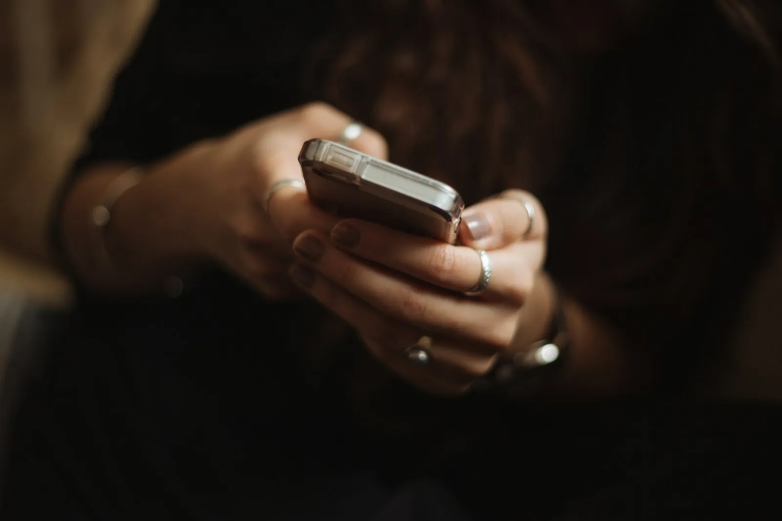 Person holding and using a smartphone, illustrating whether you need a SIM card in Korea