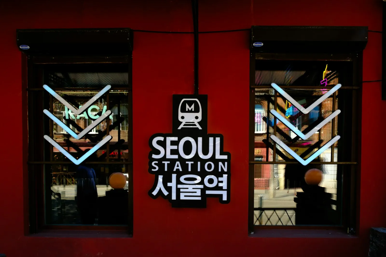 Bilingual Korean and English Seoul Station sign, illustrating how to get a Korean phone number as a foreigner