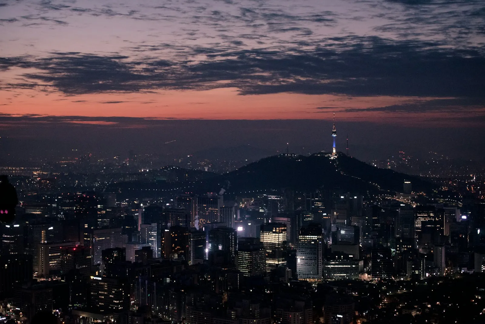 Seoul skyline at dusk with N Seoul Tower, illustrating Korea SIM and phone plan setup for long-term expats and residents